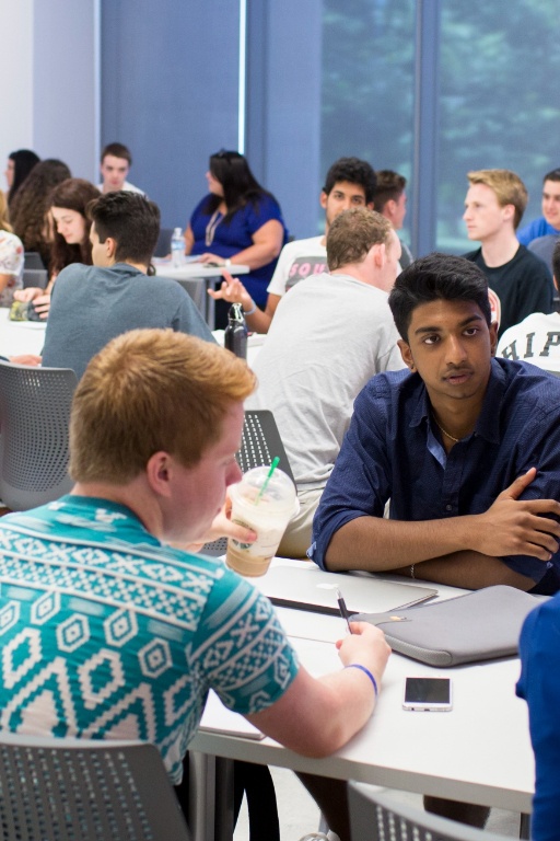 A gathering of students discussing various ideas