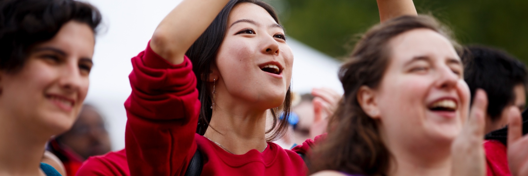 Three students cheering during Culture Fest